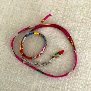 Hermes Twilly String.   Hermès silk.  Bracelet, purse accessory.  Many uses!